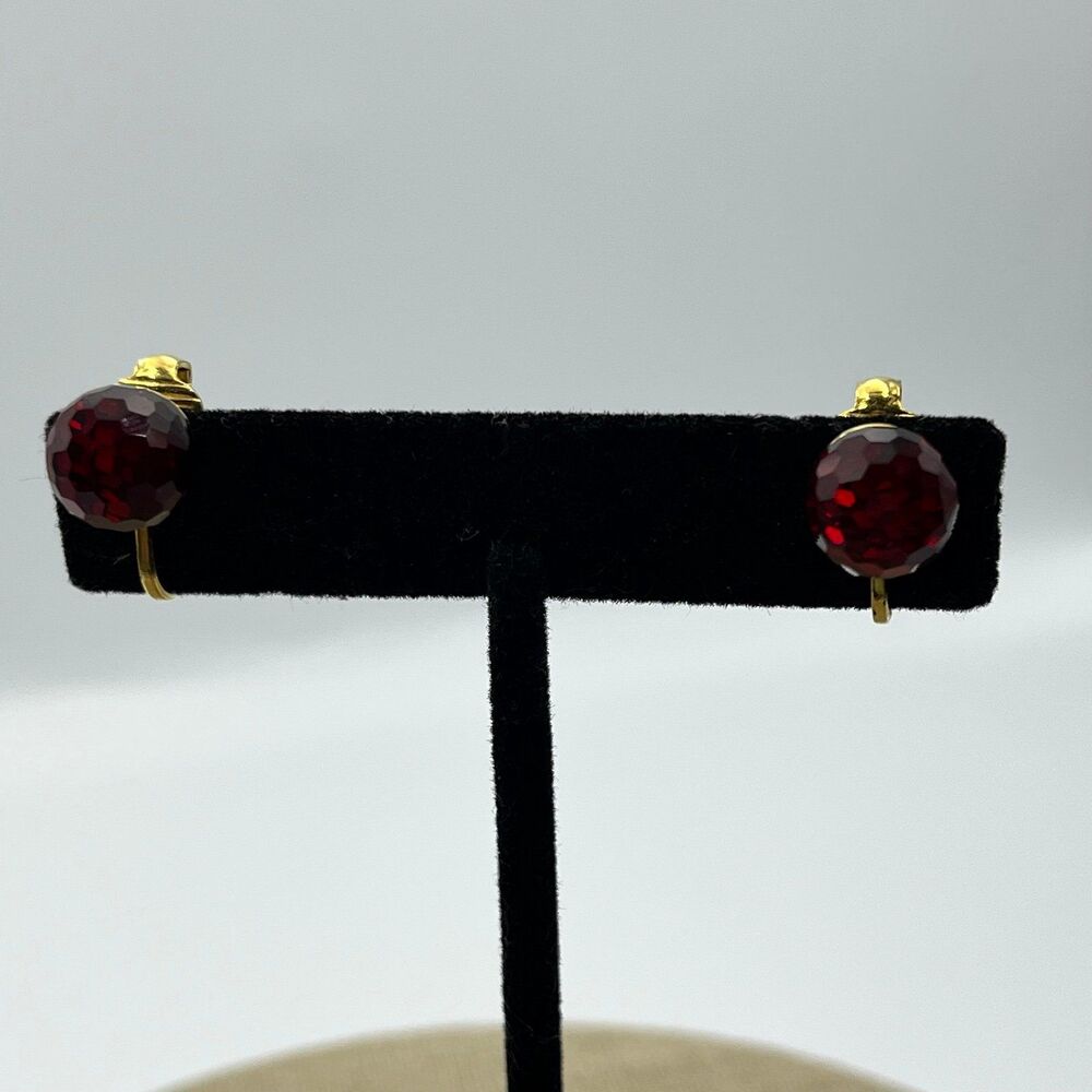 Vintage red glass multi faceted gold tone clip on earrings